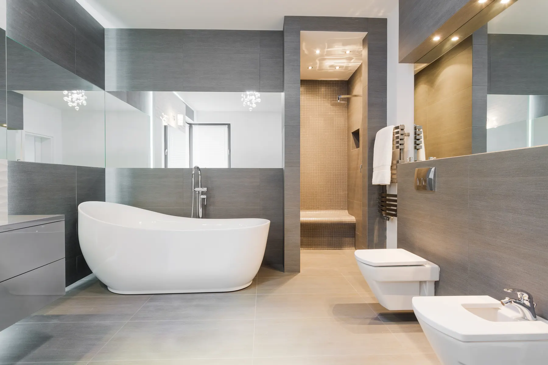 Modern bathroom with freestanding tub and glass shower